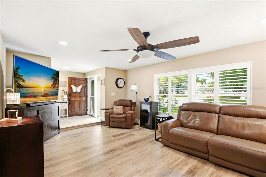2636 Talbot Road Fern Park, FL 32730 - Photo 9 of 47 a living room with furniture and a flat screen tv