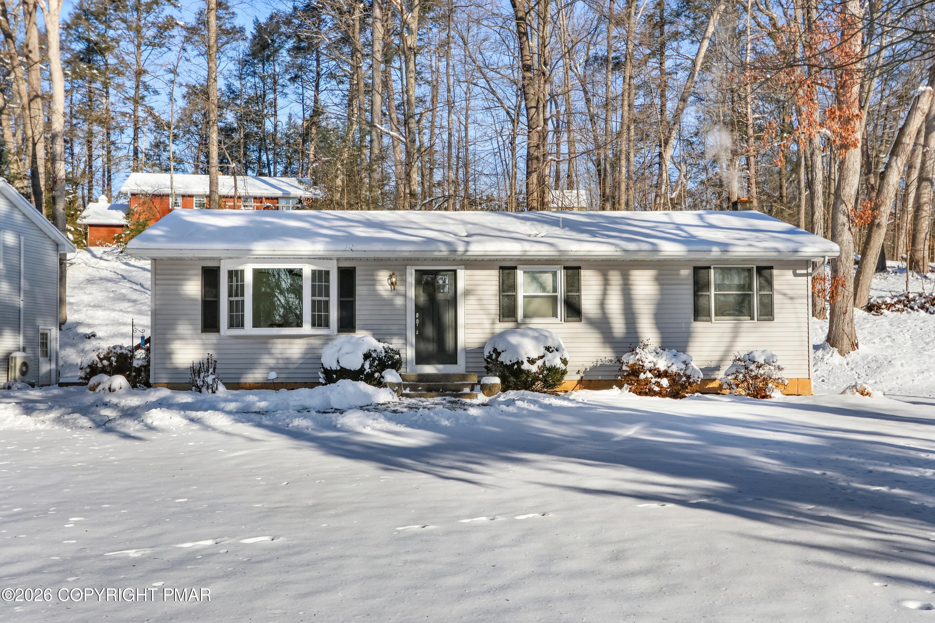 115 Clubhouse Road Saylorsburg, PA 18353 - Photo 2 of 3 a view of a house with a patio