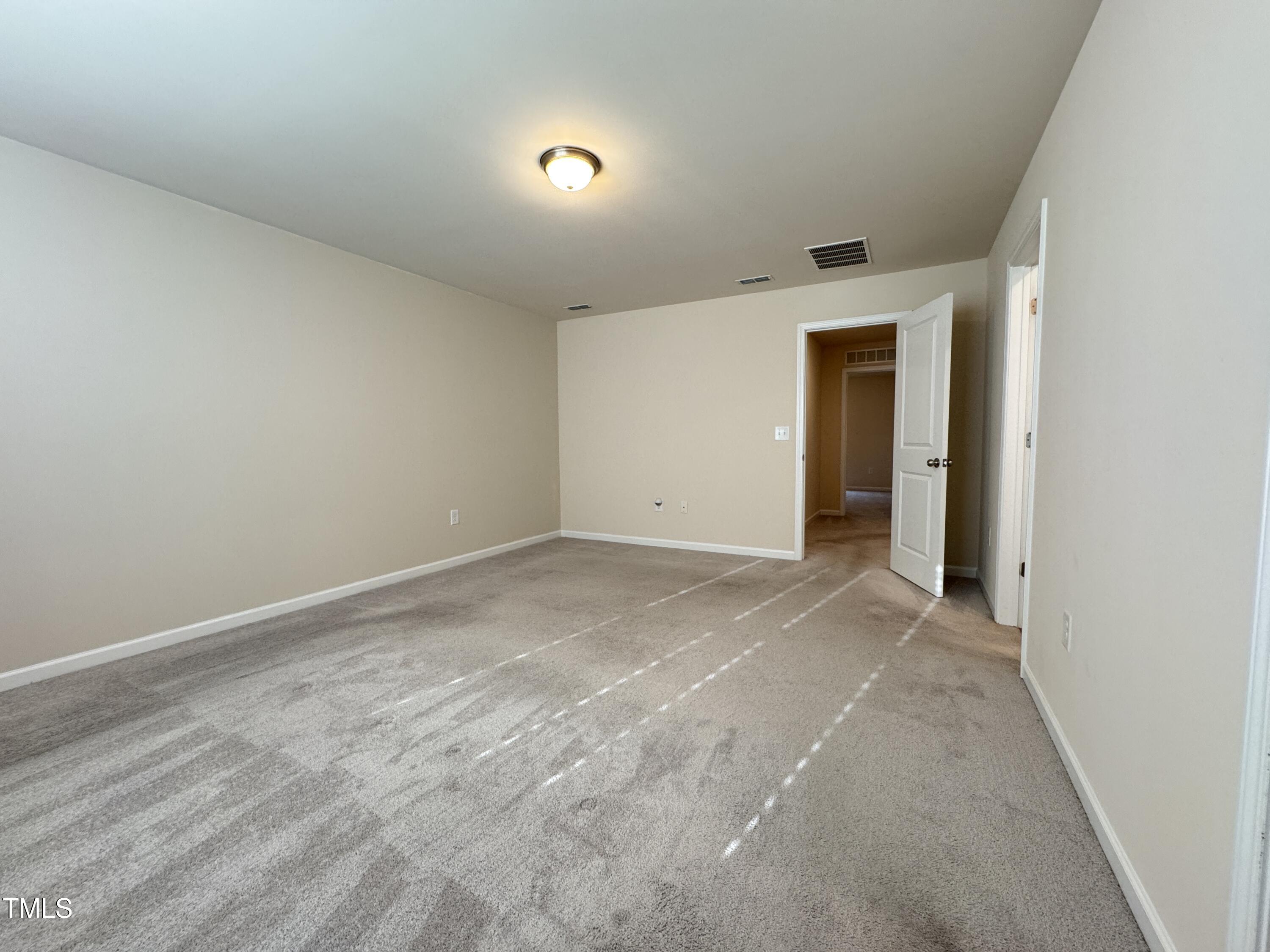 1413 Justice Union Court Raleigh, NC 27604 - Photo 14 of 29 an empty room with an entryway and empty room