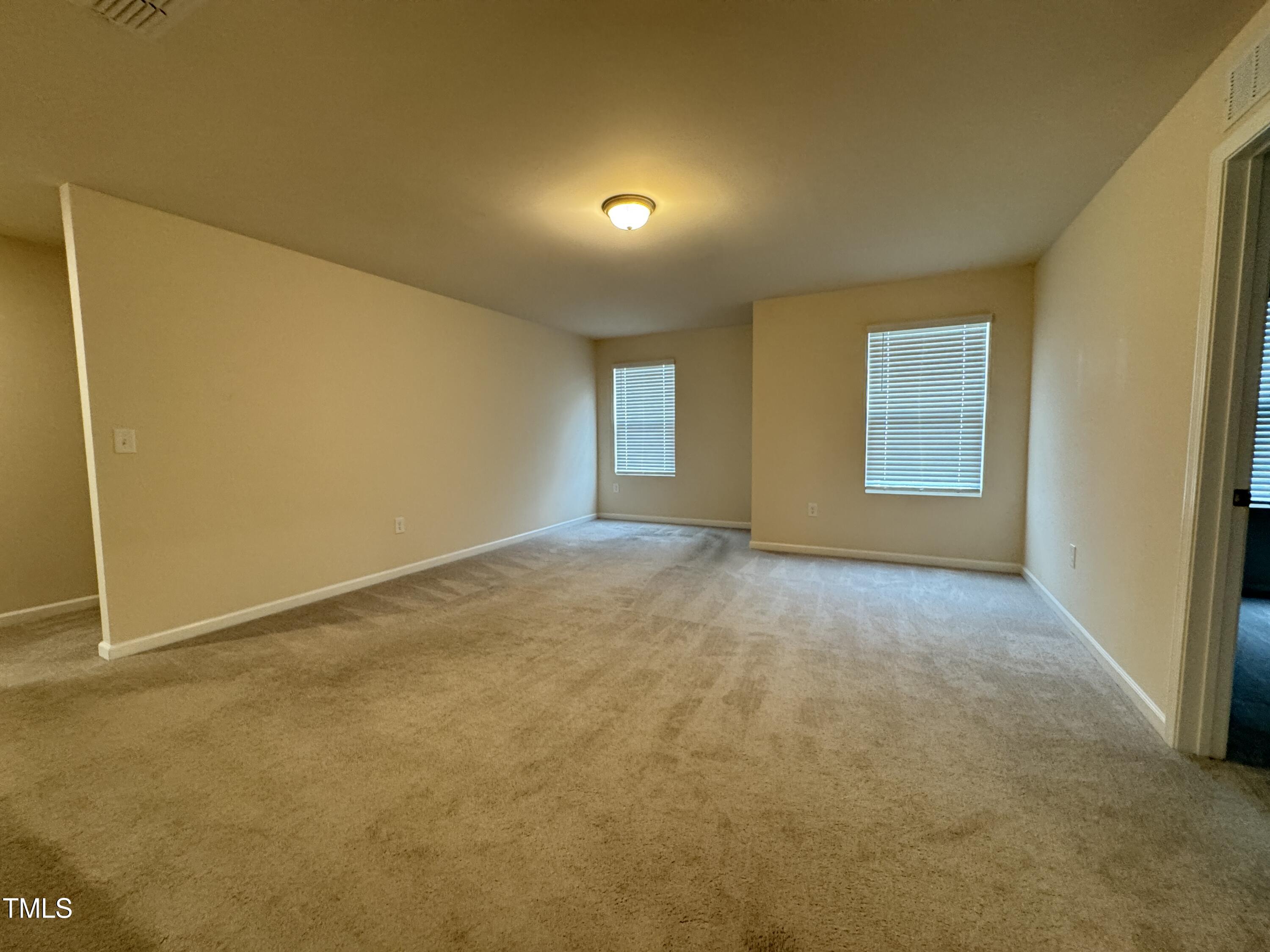 1413 Justice Union Court Raleigh, NC 27604 - Photo 21 of 29 a view of an empty room with a window