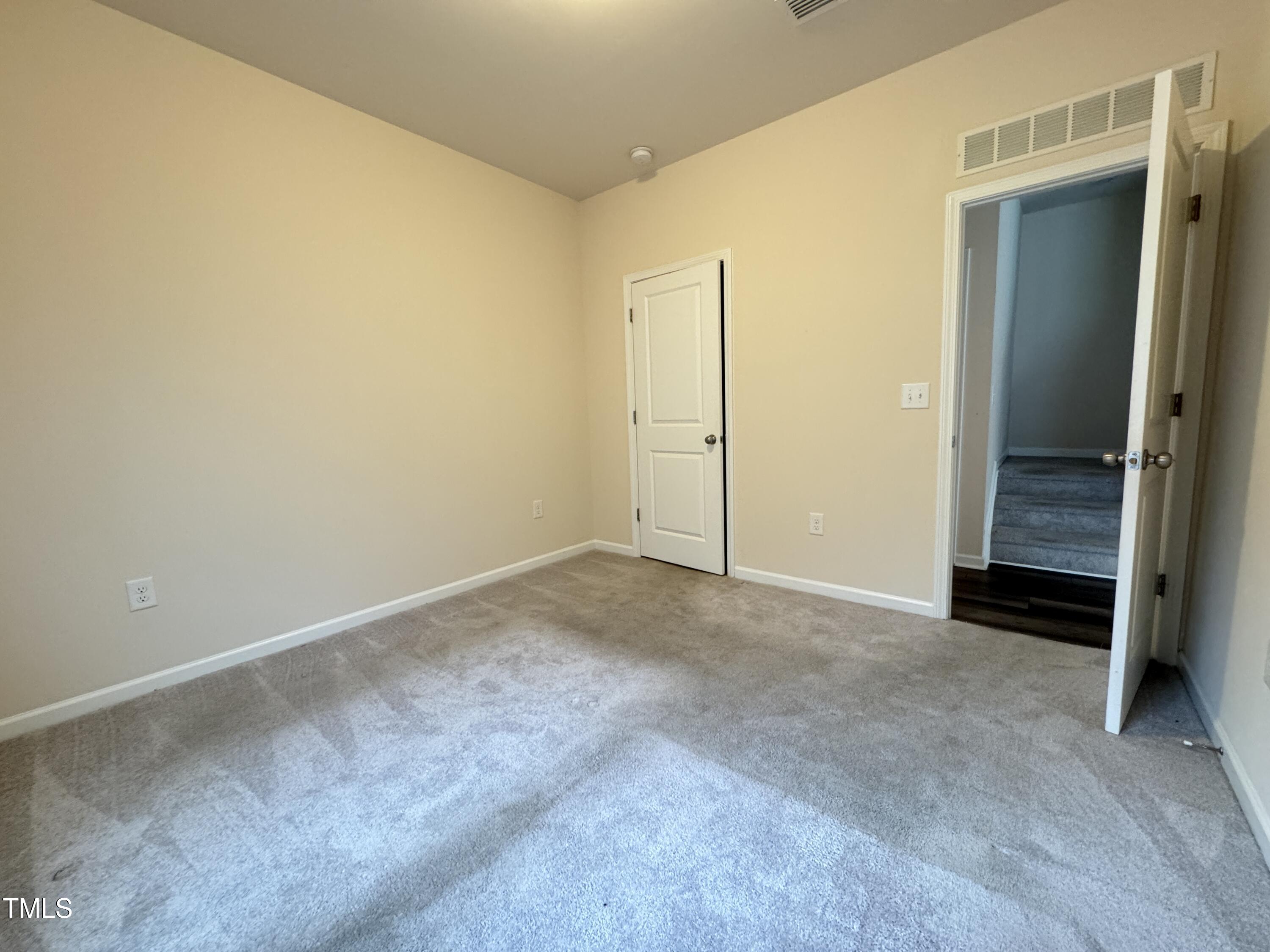1413 Justice Union Court Raleigh, NC 27604 - Photo 24 of 29 an empty room with a workbench