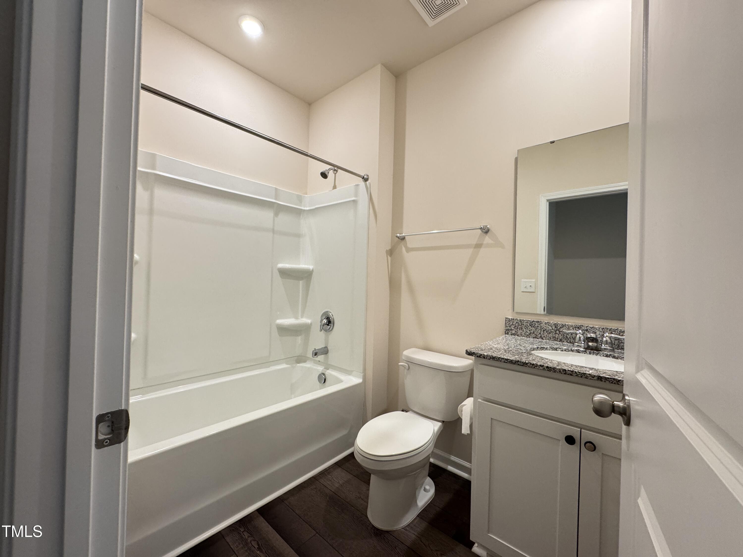 1413 Justice Union Court Raleigh, NC 27604 - Photo 25 of 29 a bathroom with a toilet sink and shower