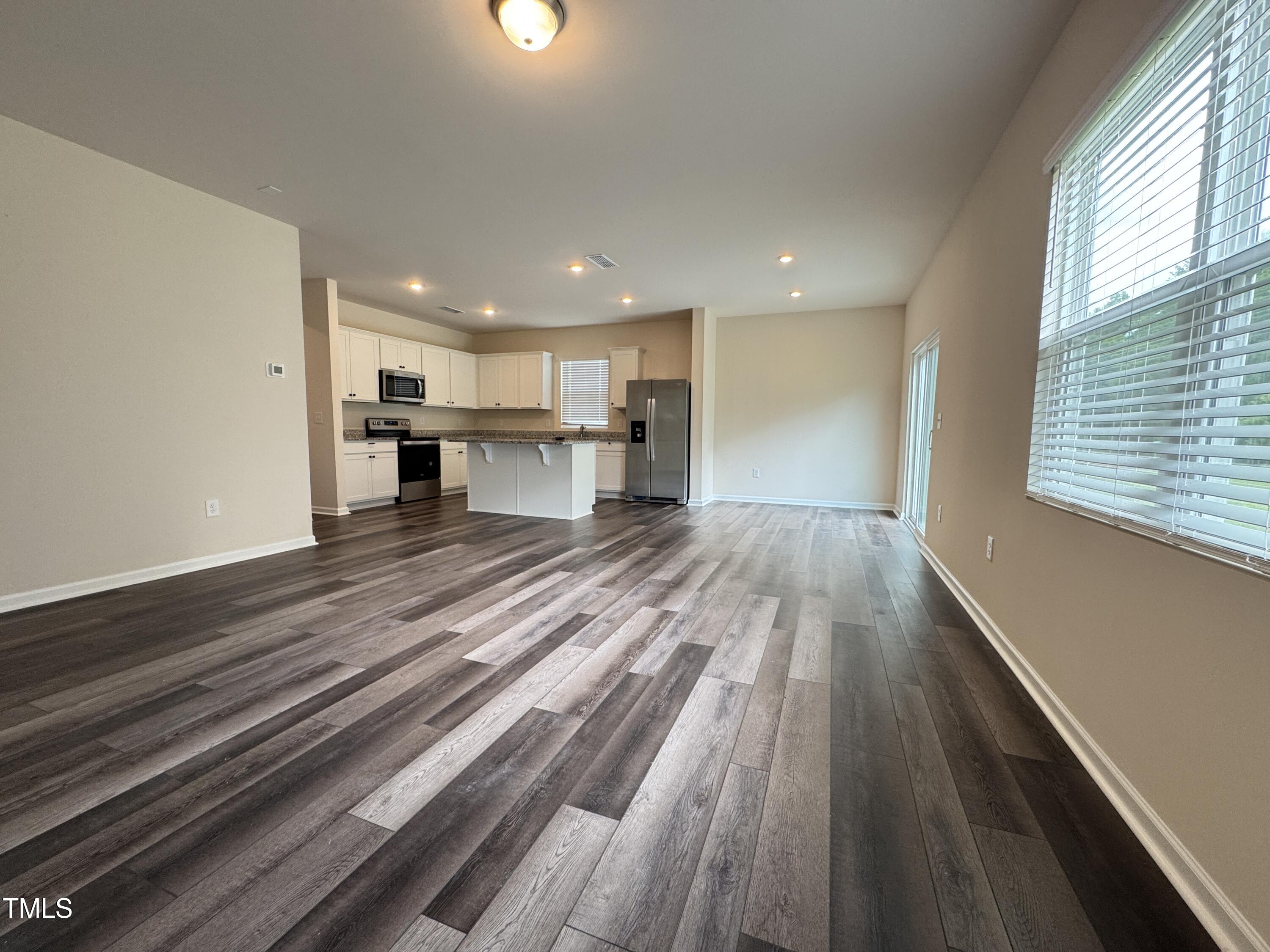 1413 Justice Union Court Raleigh, NC 27604 - Photo 5 of 29 a view of kitchen with wooden floor