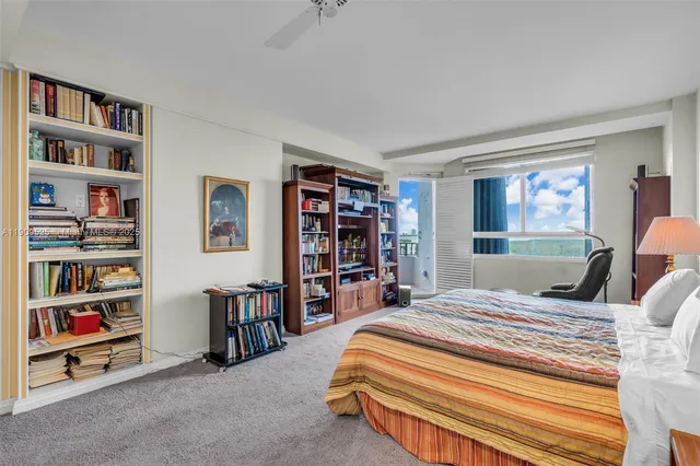 a spacious bedroom with a bed and a walk in closet