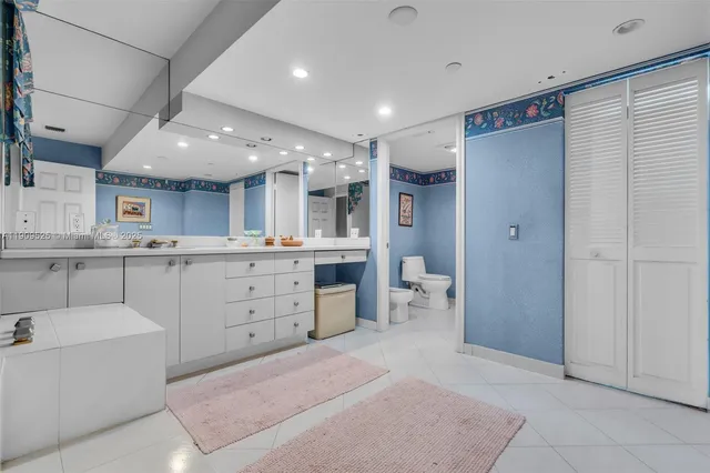 a bathroom with a sink vanity and mirror
