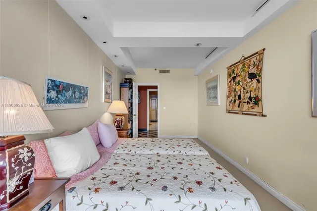 a bedroom with a bed and lamp