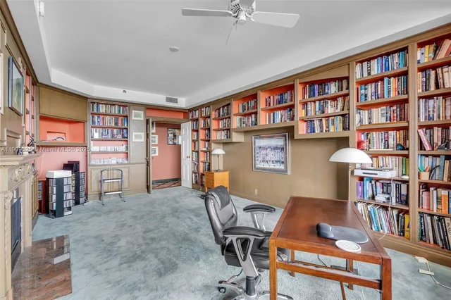 a bed room with a bed and a book shelf