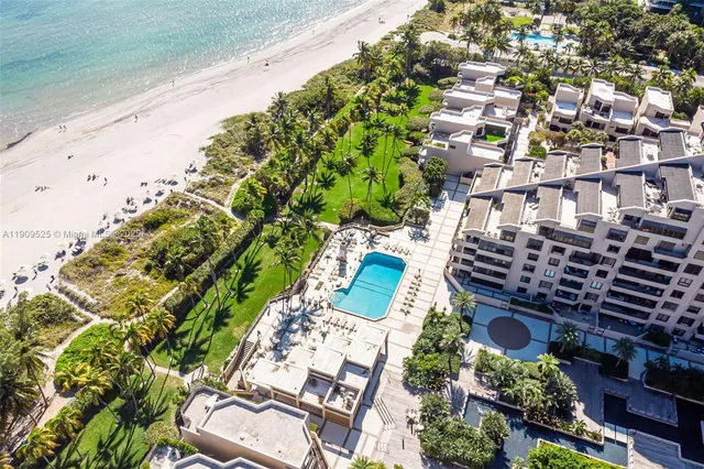 a view of a swimming pool with a lounge chairs