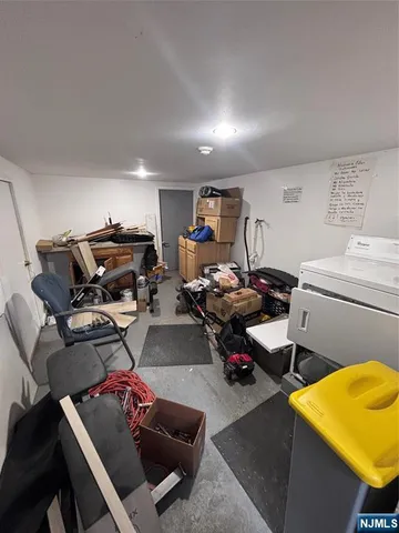 a bathroom with a granite countertop toilet a sink and a mirror