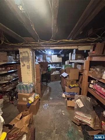 a kitchen with a table chairs refrigerator and microwave