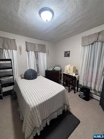 a bathroom with a sink vanity and toilet
