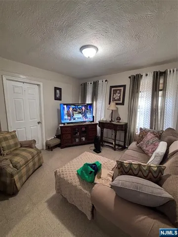a kitchen with a refrigerator a stove top oven and a sink