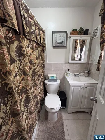 a living room with furniture window and a wooden floor