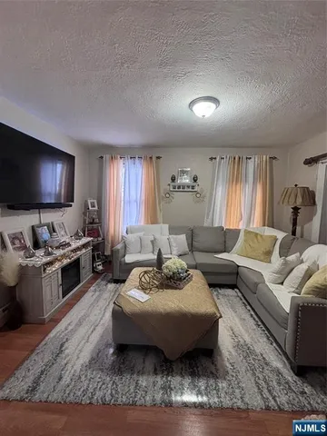a view of a livingroom with furniture and toys
