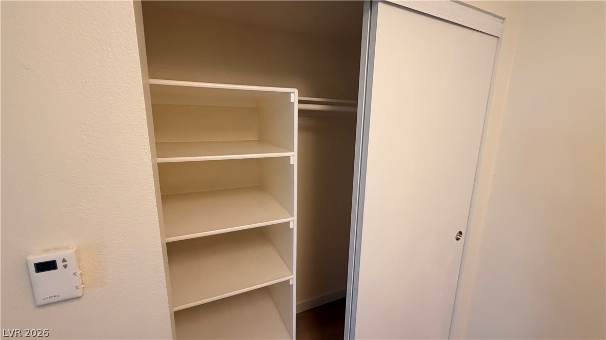 7885 West Flamingo Road, Unit 1131 Las Vegas, NV 89147 - Photo 23 of 36 A well-organized closet system provides ample storage with integrated shelving and hanging space.