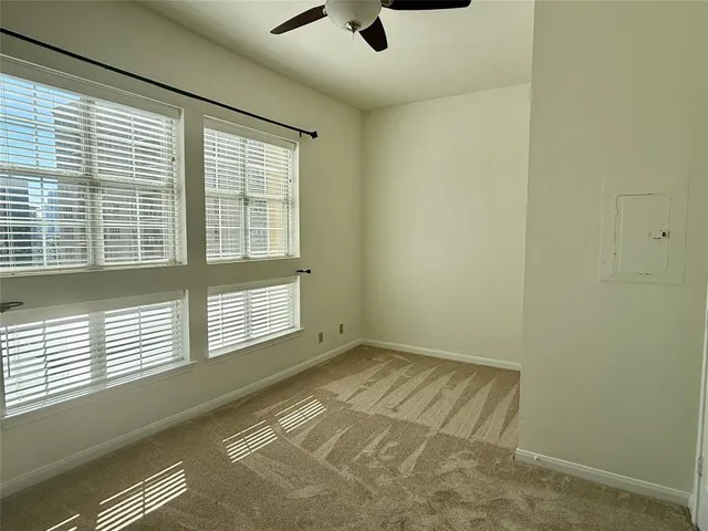 a view of an empty room and a window
