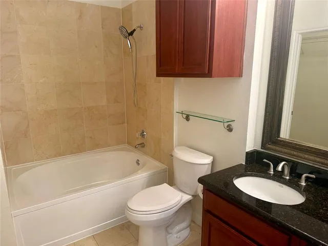 a bathroom with a sink a toilet and a bathtub