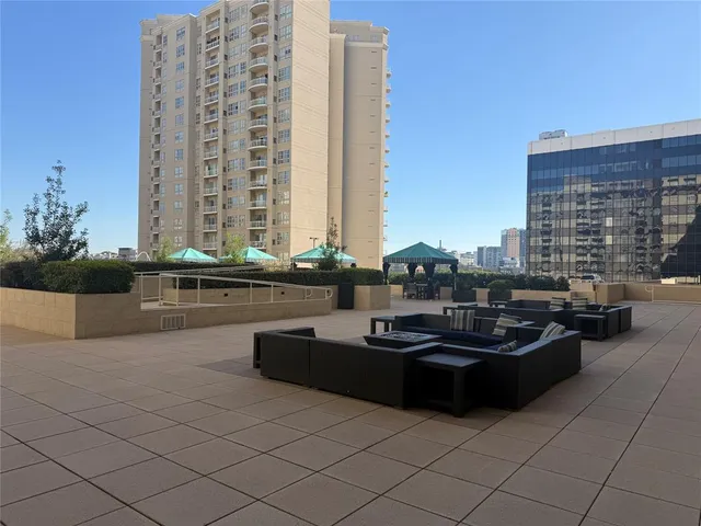 a kitchen with granite countertop a sink and a stove
