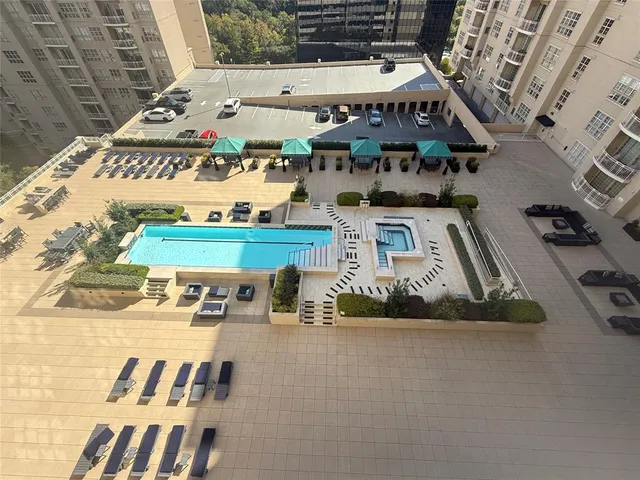 a view of swimming pool with outdoor seating