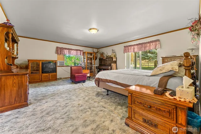 a room with furniture and a large window