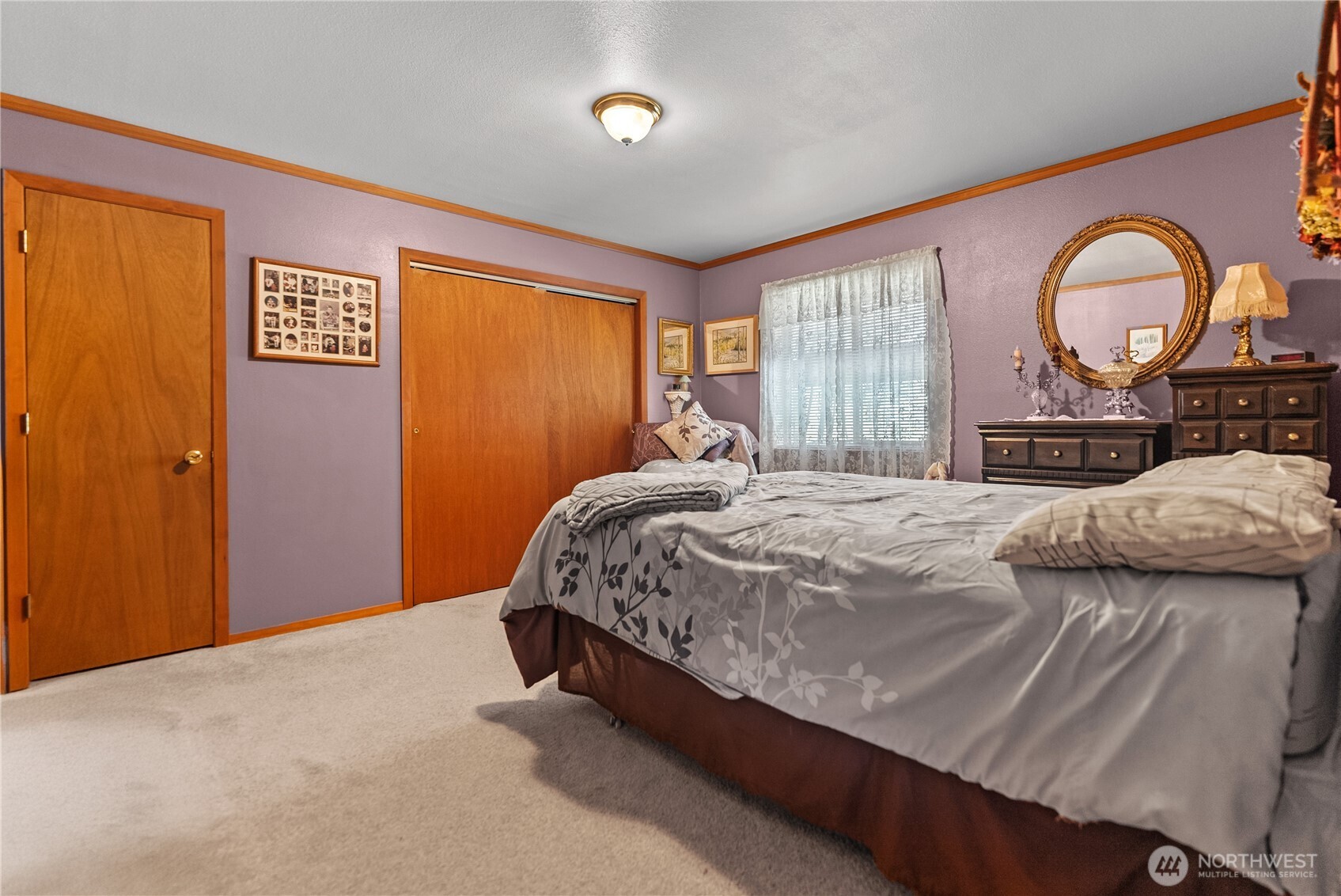 54 B Ross Road, Unit B Twisp, WA 98856 - Photo 18 of 40 a large bed sitting in a bedroom next to a window