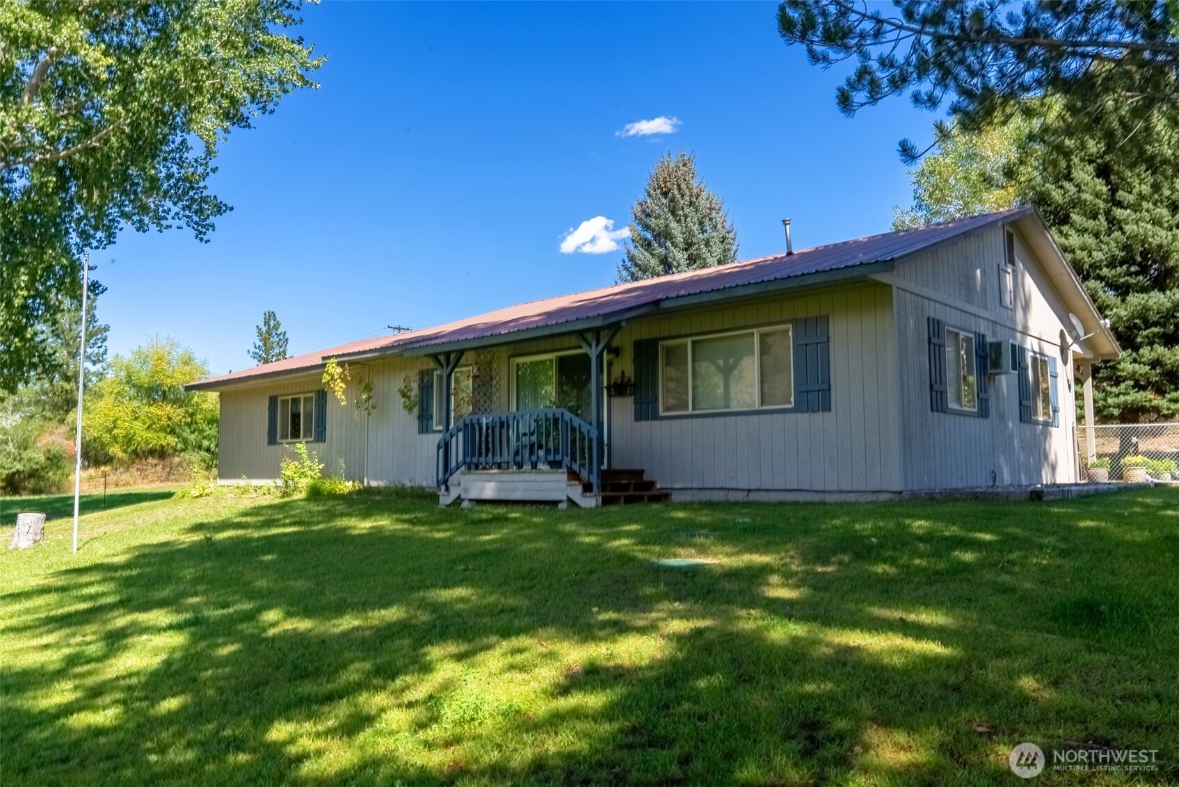 54 B Ross Road, Unit B Twisp, WA 98856 - Photo 2 of 40 a view of a house with a yard