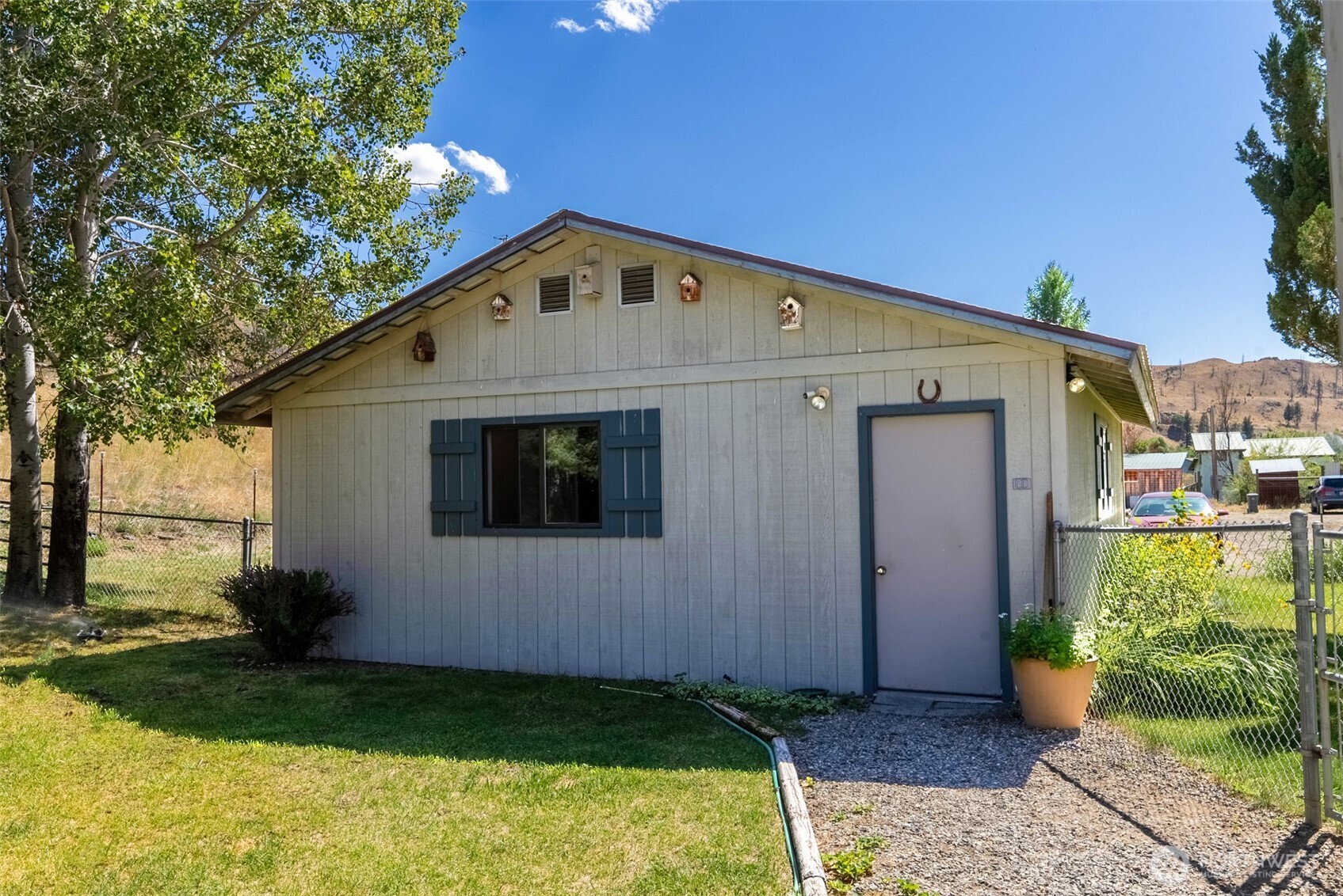54 B Ross Road, Unit B Twisp, WA 98856 - Photo 26 of 40 a front view of a house with garden