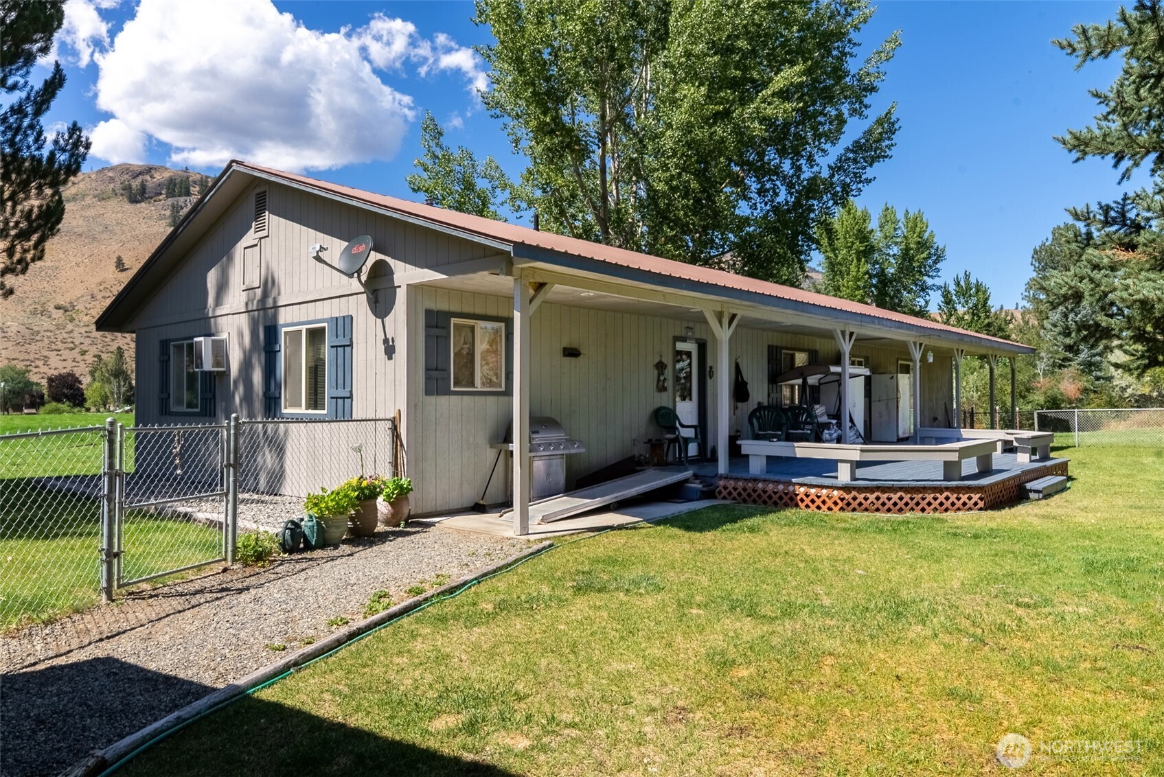 54 B Ross Road, Unit B Twisp, WA 98856 - Photo 27 of 40 a view of house with swimming pool and a yard
