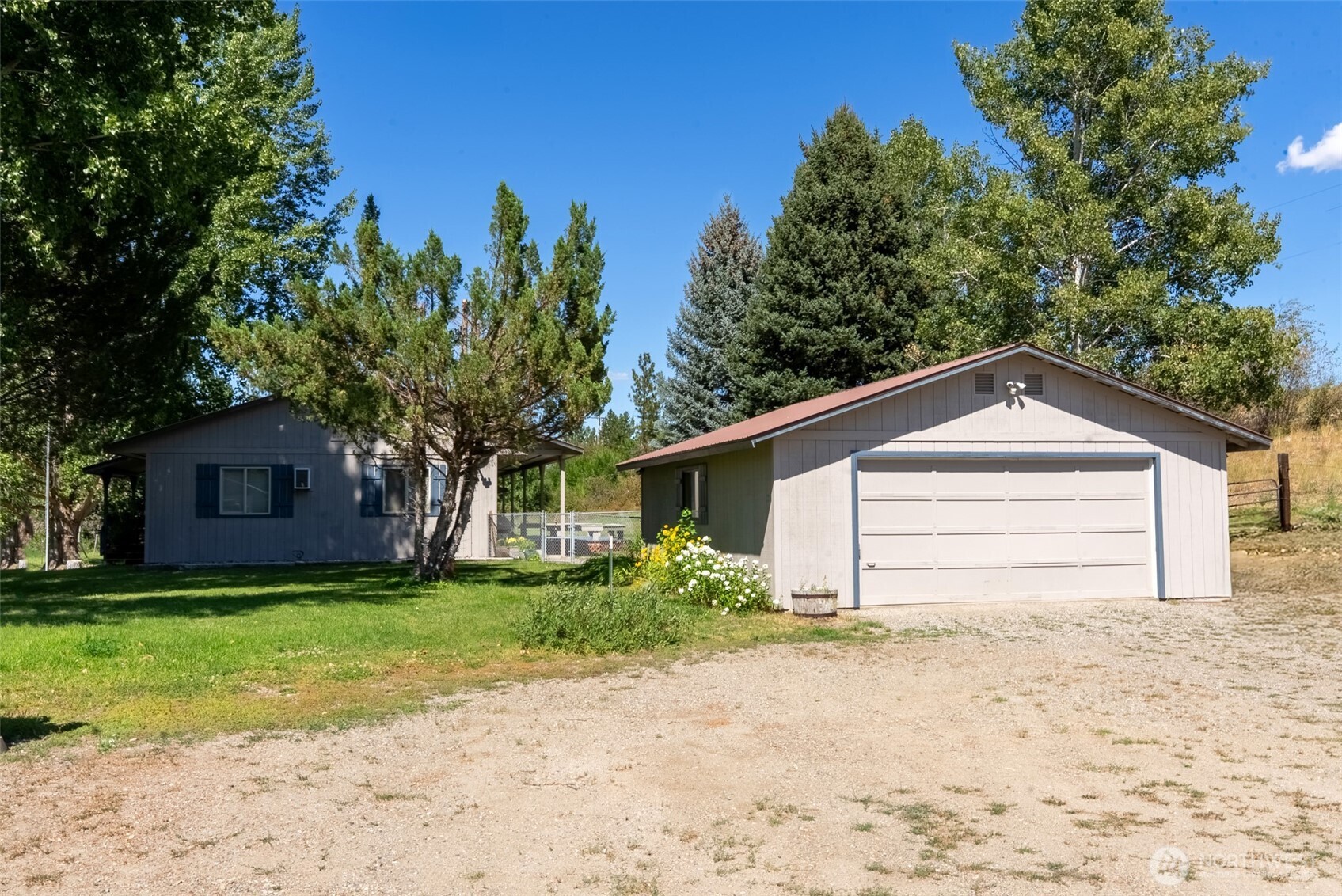 54 B Ross Road, Unit B Twisp, WA 98856 - Photo 28 of 40 a house with a yard