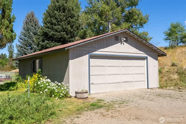 a small barn with a small yard
