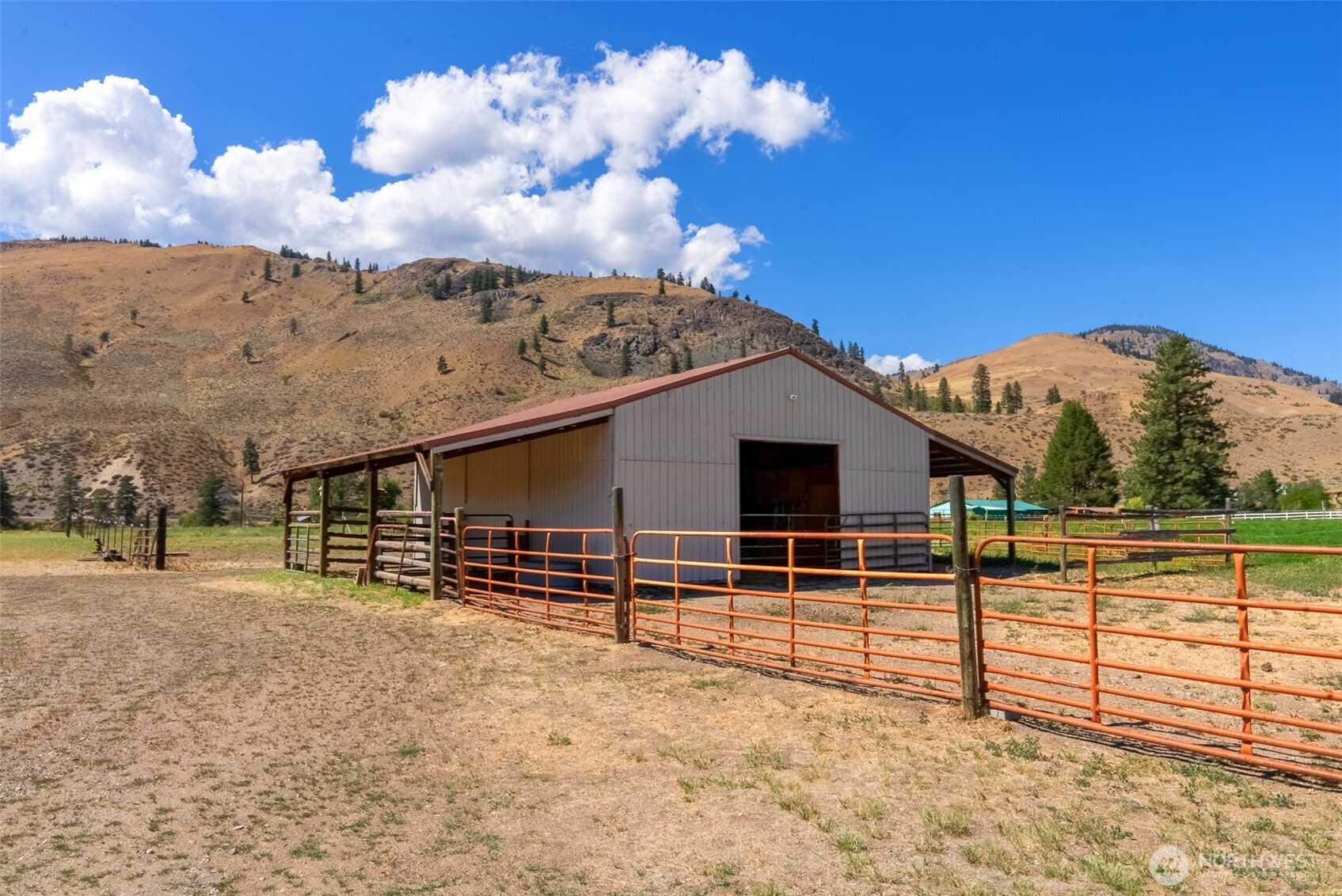 54 B Ross Road, Unit B Twisp, WA 98856 - Photo 36 of 40 a view of a house with a snow in the background