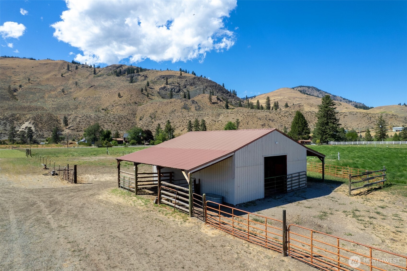 54 B Ross Road, Unit B Twisp, WA 98856 - Photo 37 of 40 a view of a house with a yard