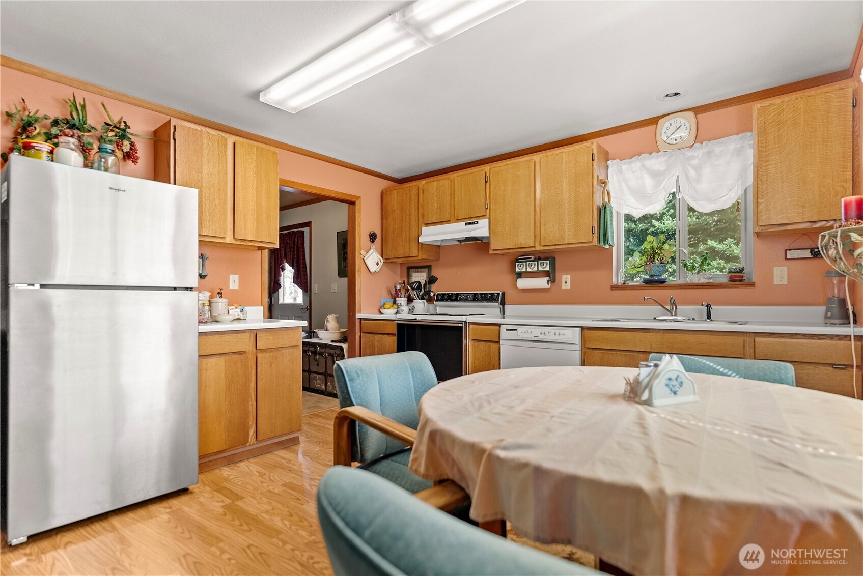 54 B Ross Road, Unit B Twisp, WA 98856 - Photo 5 of 40 a kitchen with stainless steel appliances kitchen island granite countertop a refrigerator a stove and a sink with dishwasher