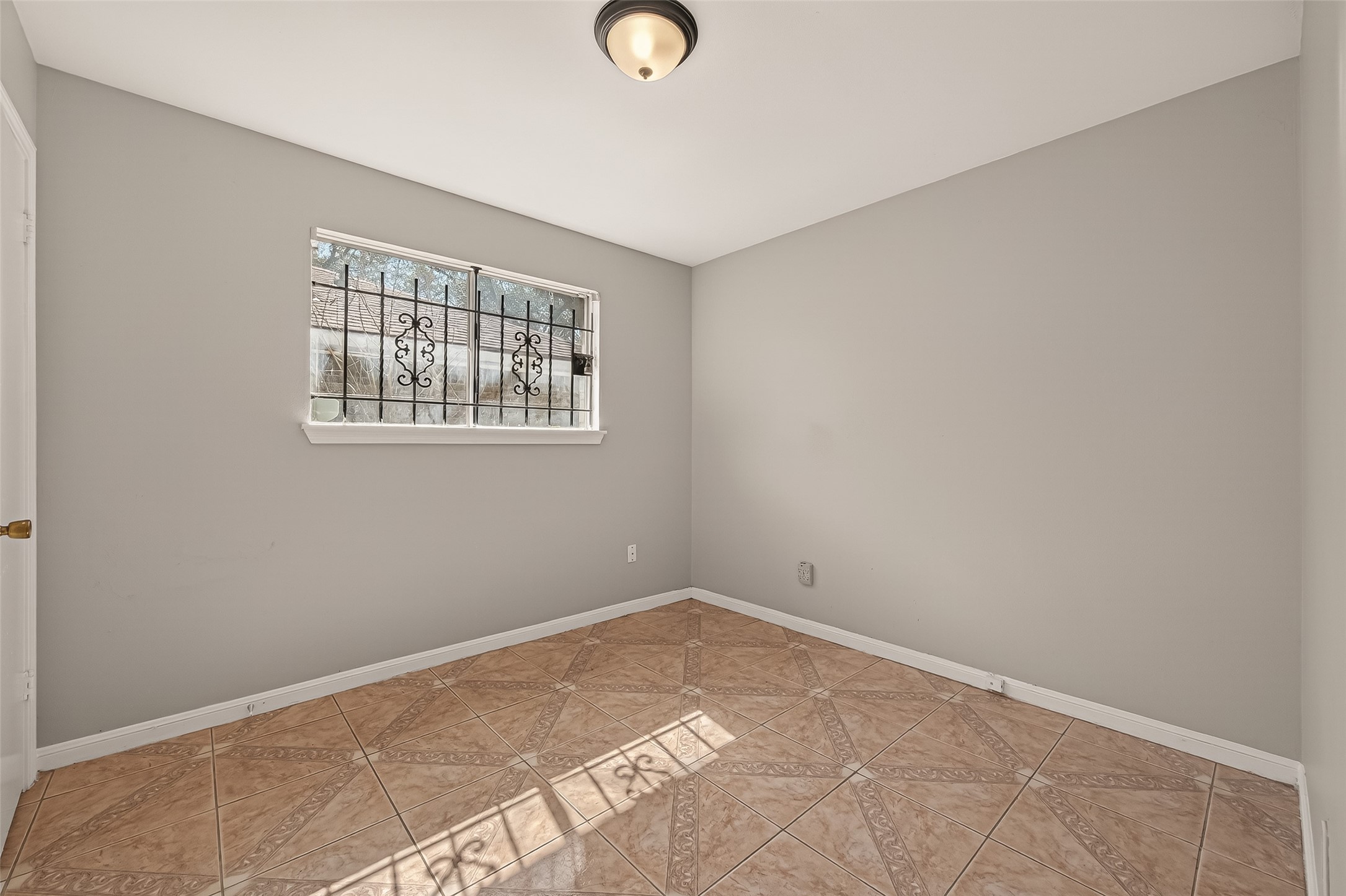 10607 Bainbridge Street Houston, TX 77016 - Photo 29 of 43 a view of an empty room with a window