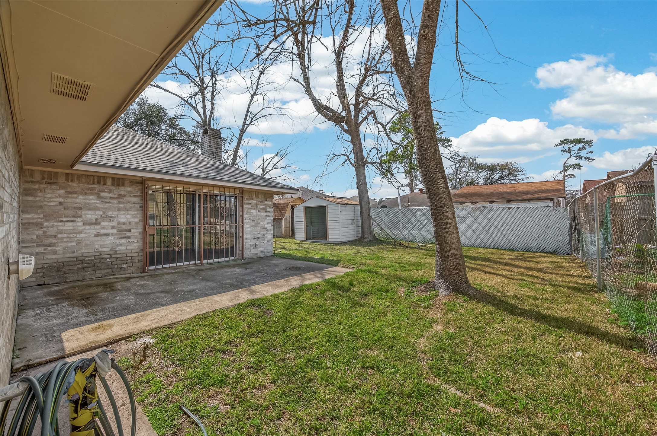 10607 Bainbridge Street Houston, TX 77016 - Photo 40 of 43 a view of a house with a backyard