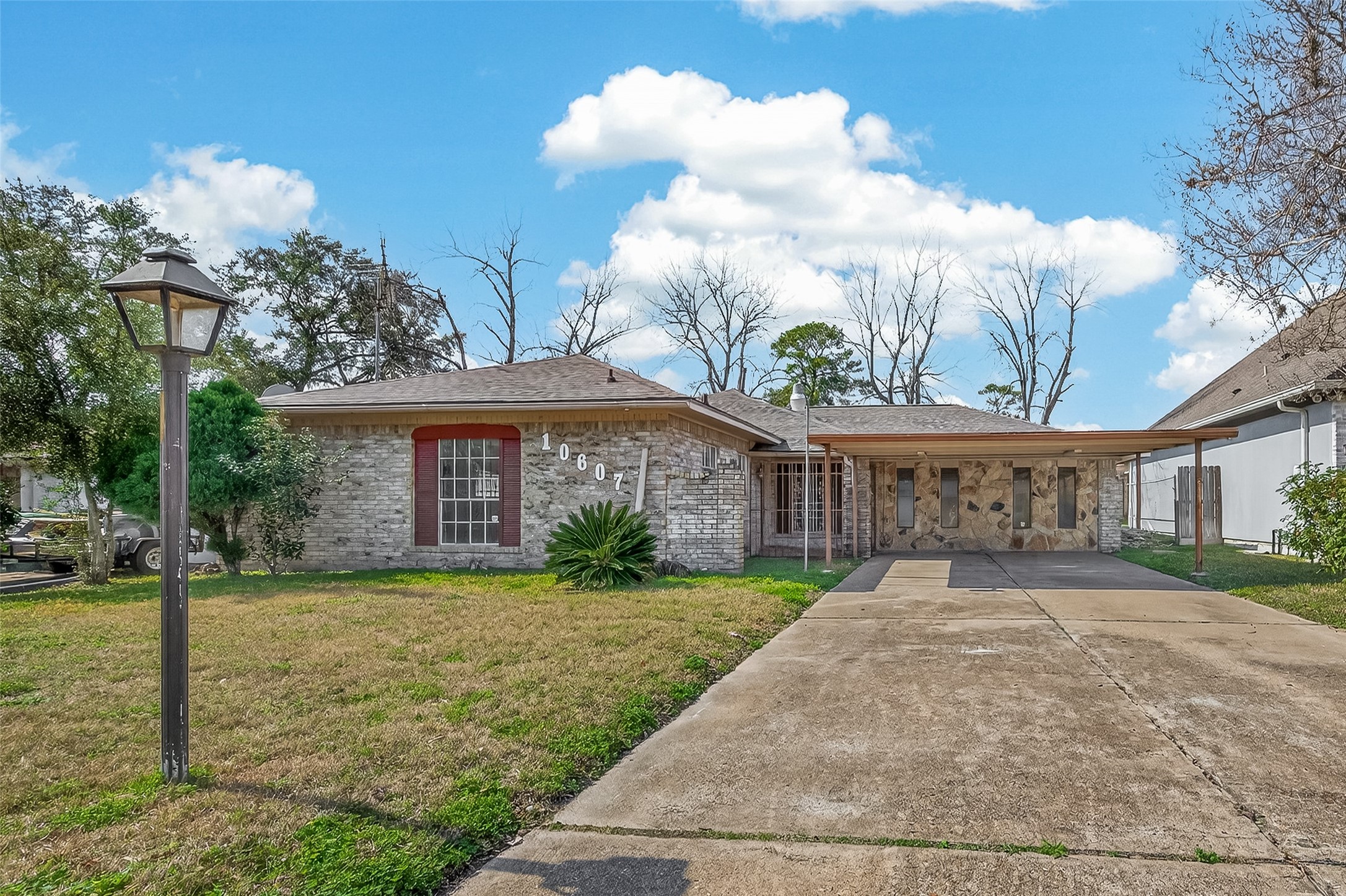 10607 Bainbridge Street Houston, TX 77016 - Photo 4 of 43 a front view of a house with garden