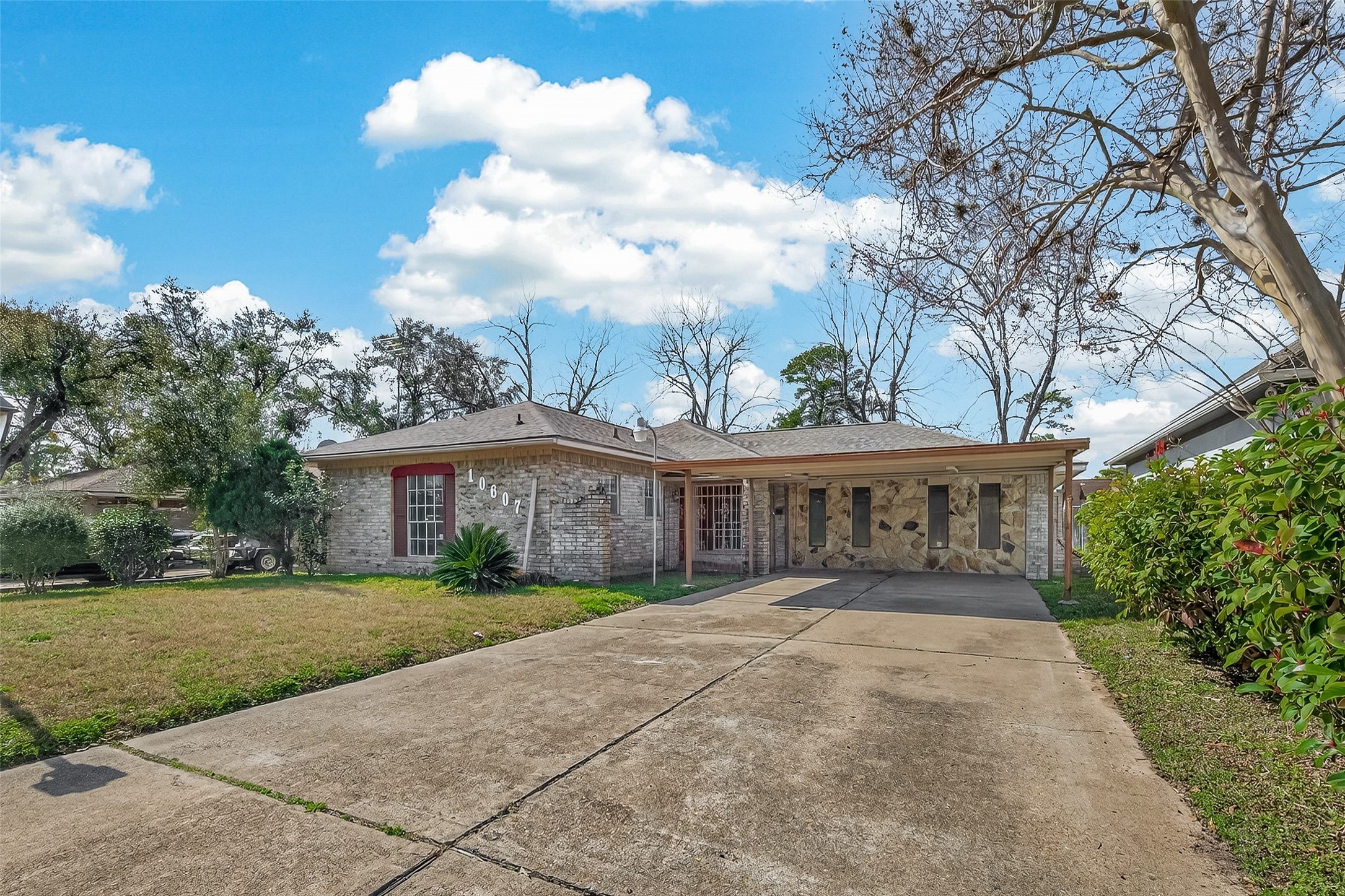 10607 Bainbridge Street Houston, TX 77016 - Photo 5 of 43 a view of house with yard and green space