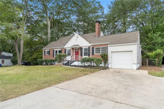 a front view of a house with a garden and porch