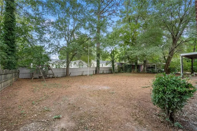 a view of a tree in front of a house