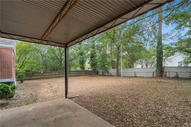 a house with trees in the background