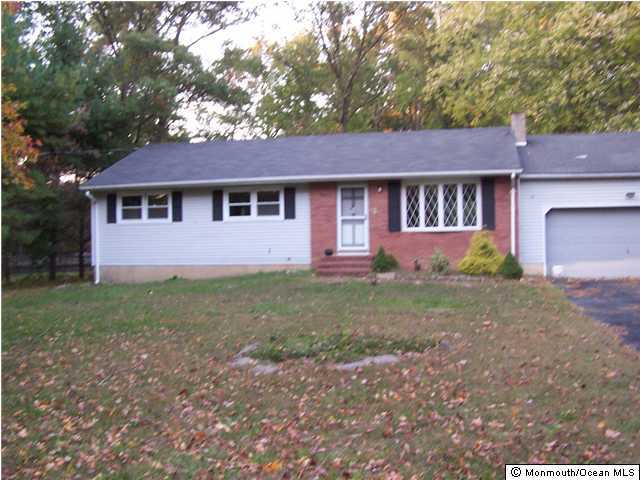 29 Brown Road Morganville, NJ 07751 - Photo 1 of 3 a front view of a house with yard