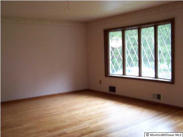 29 Brown Road Morganville, NJ 07751 - Photo 2 of 3 an empty room with a window