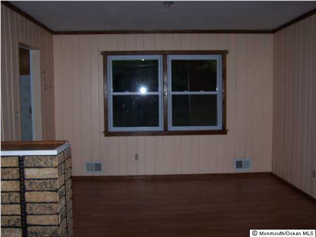 29 Brown Road Morganville, NJ 07751 - Photo 3 of 3 a view of wooden floor and windows in a room