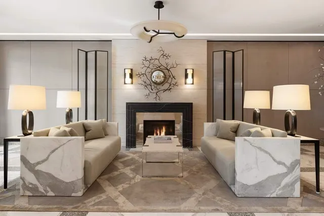 a view of a patio with couches table and chairs and potted plants
