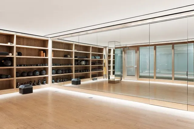 a bathroom with a granite countertop shower sink and mirror