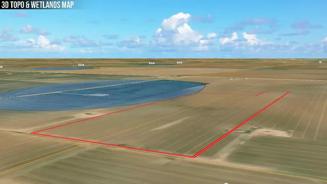 a view of a field with an ocean view