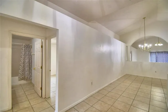 a view of an empty room with glass door