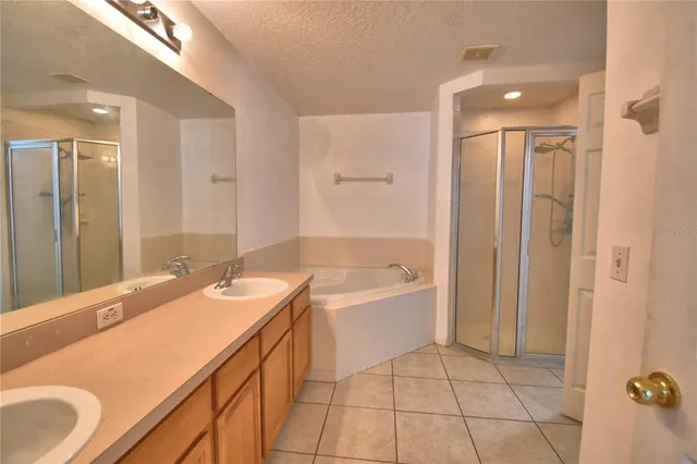 a bathroom with a sink a mirror and a bathtub