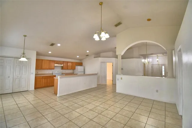 a view of a kitchen with a sink and cabinets