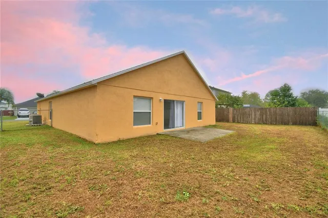 a view of a backyard of the house